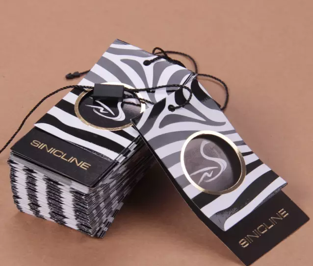 服裝吊牌生產(chǎn)廠家-廣州駿業(yè)包裝實業(yè)有限公司 服裝吊牌生產(chǎn)廠家